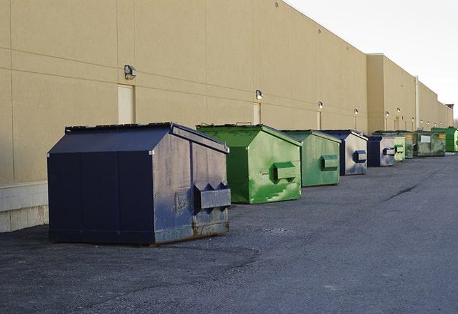 a group of construction workers taking a break near a dumpster in Golden City